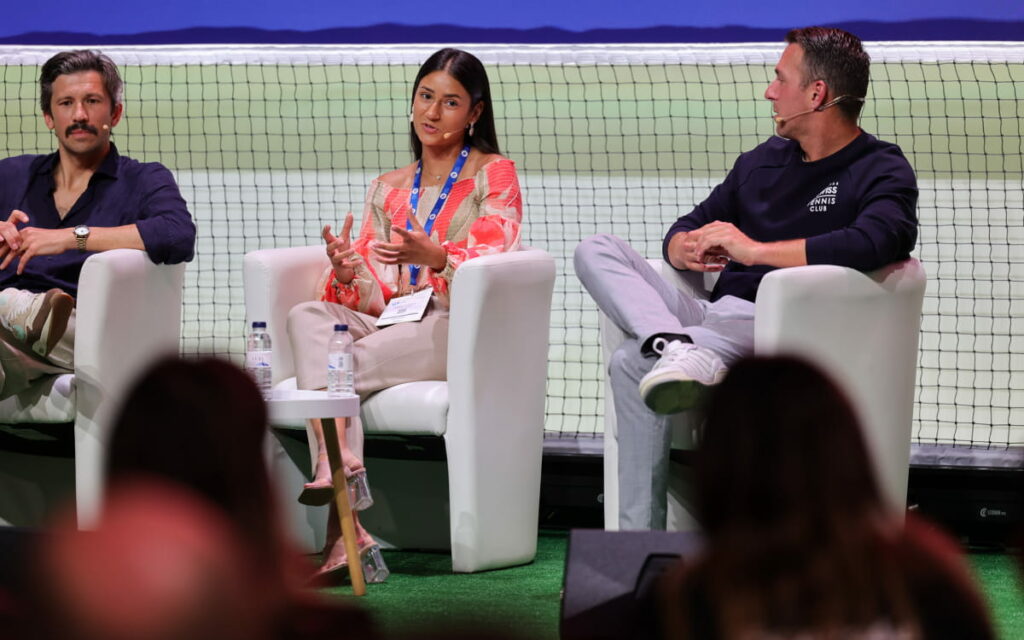 Three speakers talking to the audience at PWS.